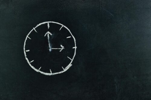 analog clock sketch in black surface